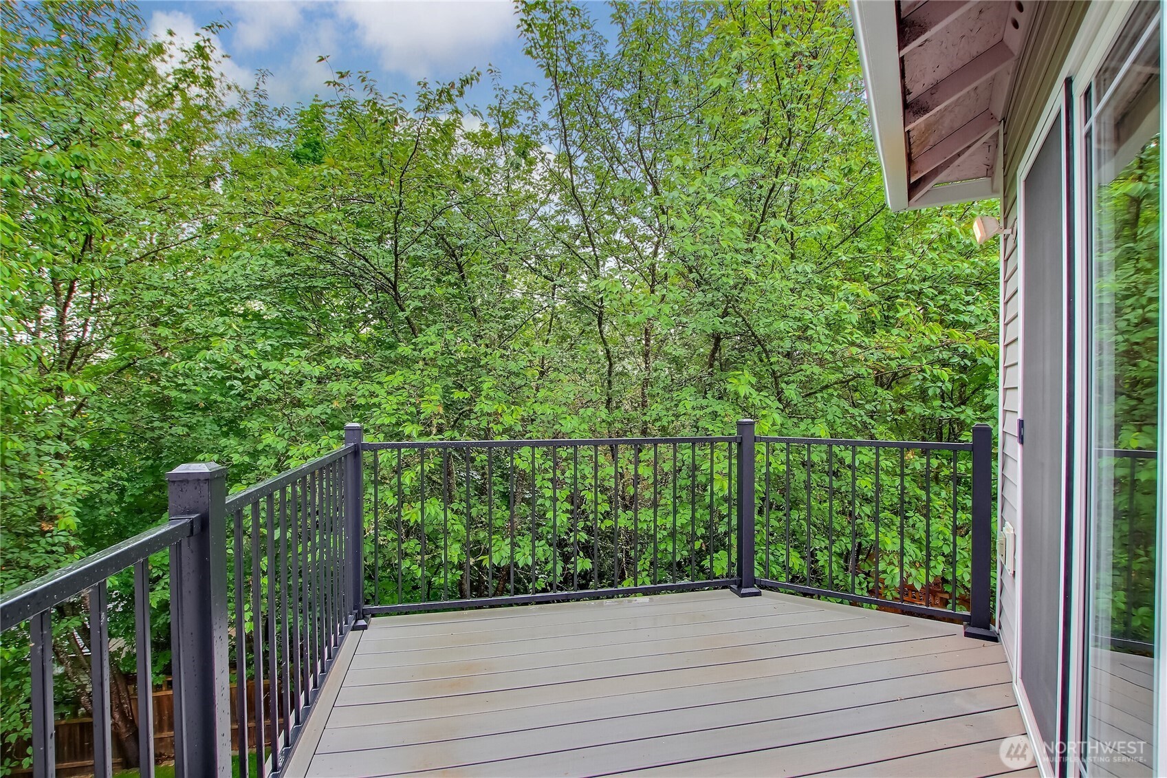 9430 Northeast 181st Lane Bothell, WA 98011 - Photo 14 of 25 a view of a balcony with wooden floor