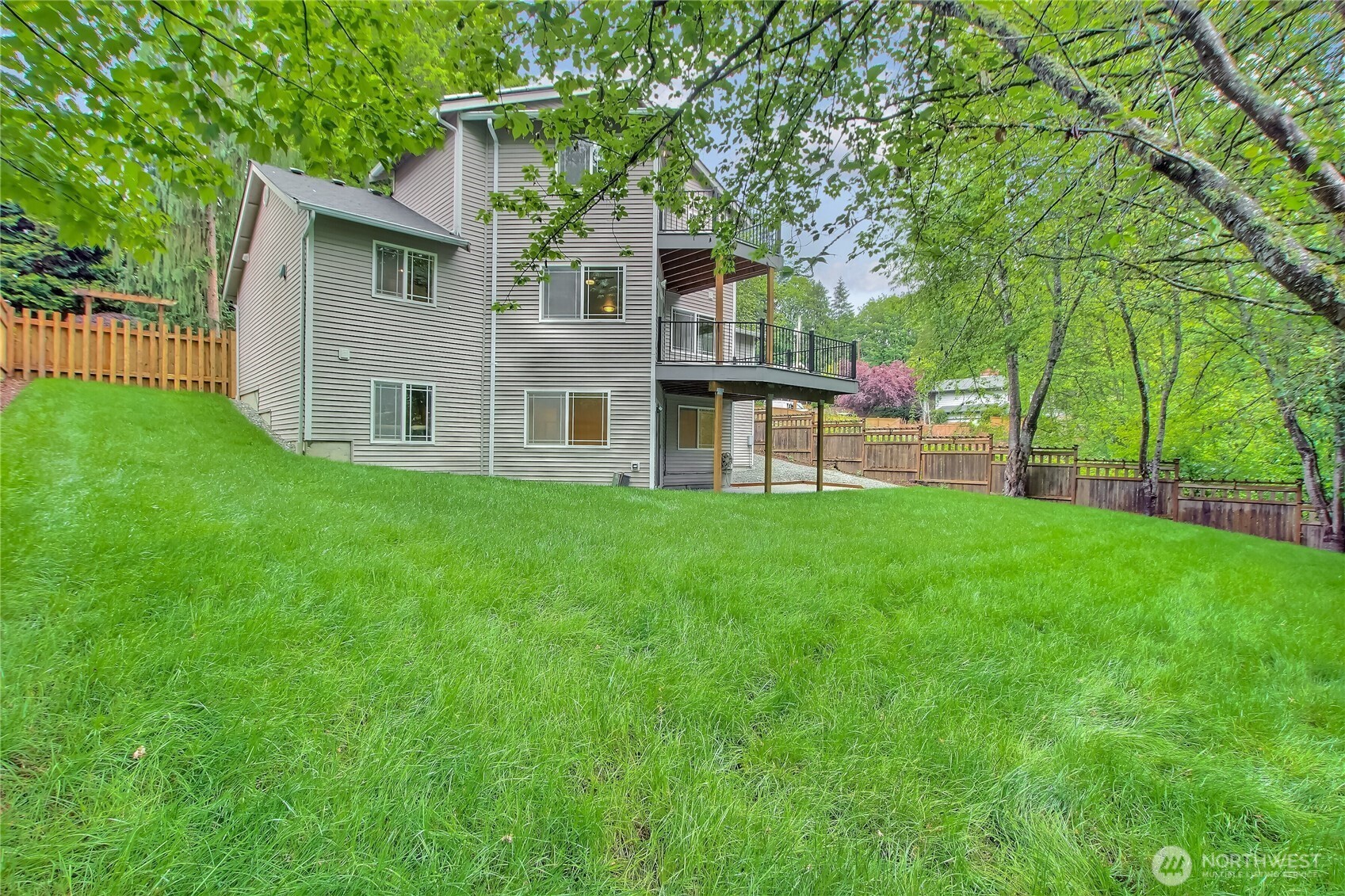 9430 Northeast 181st Lane Bothell, WA 98011 - Photo 16 of 25 a view of a house with a yard and sitting area