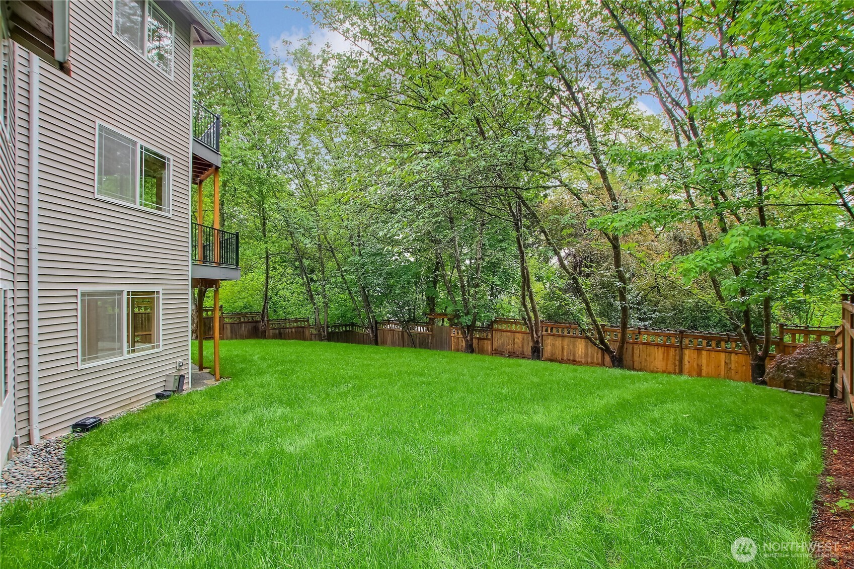9430 Northeast 181st Lane Bothell, WA 98011 - Photo 17 of 25 a view of a backyard with a garden