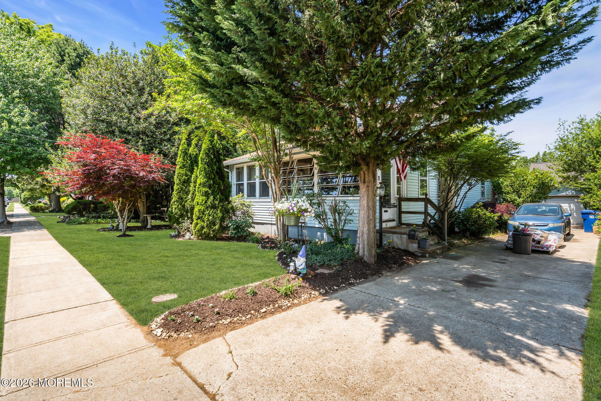 24 Foster Street Middletown, NJ 07701 - Photo 2 of 23 a front view of a house with a garden