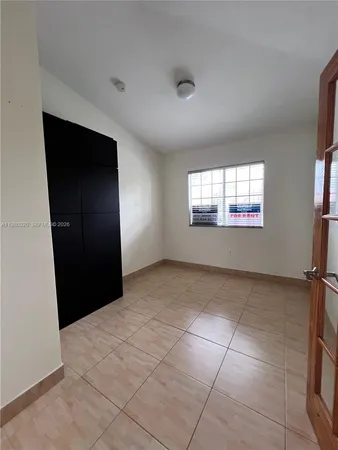 a view of an empty room and window