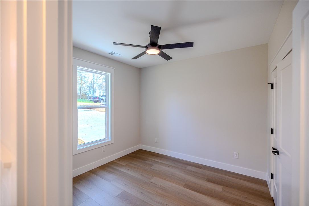 1409 Stonehurst Road Anderson, SC 29621 - Photo 16 of 37 Bright and airy room with sleek flooring and natural light.