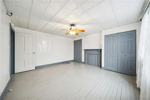 a view of an empty room and a window