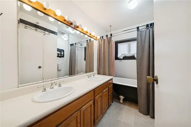 a bathroom with a sink and mirror