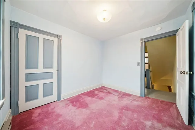 a view of a house with wooden deck