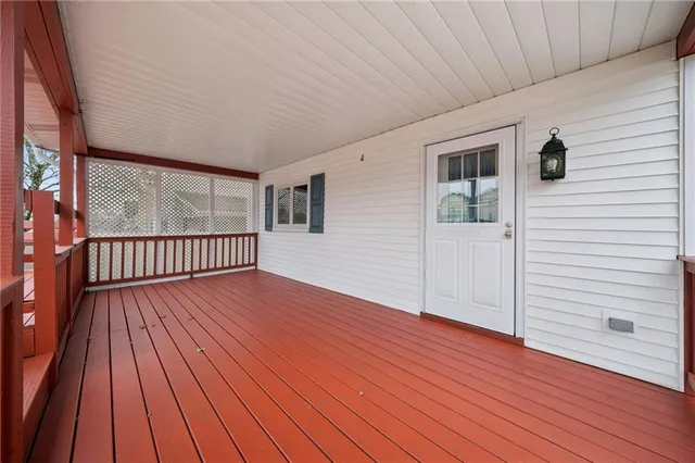 a view of a balcony with wooden floor