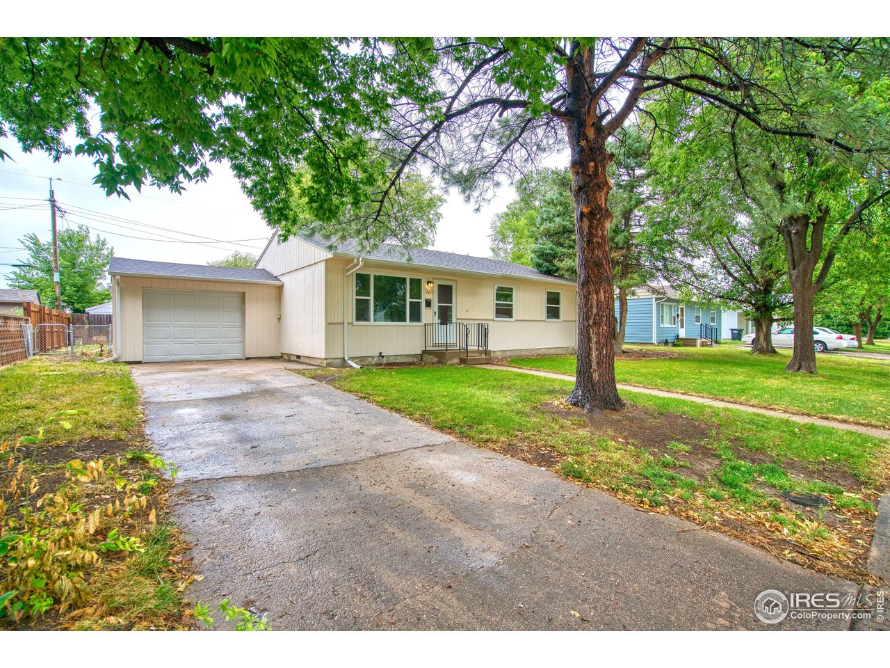 361 Delaware Street Sterling, CO 80751 - Photo 1 of 27 a front view of house with yard and green space