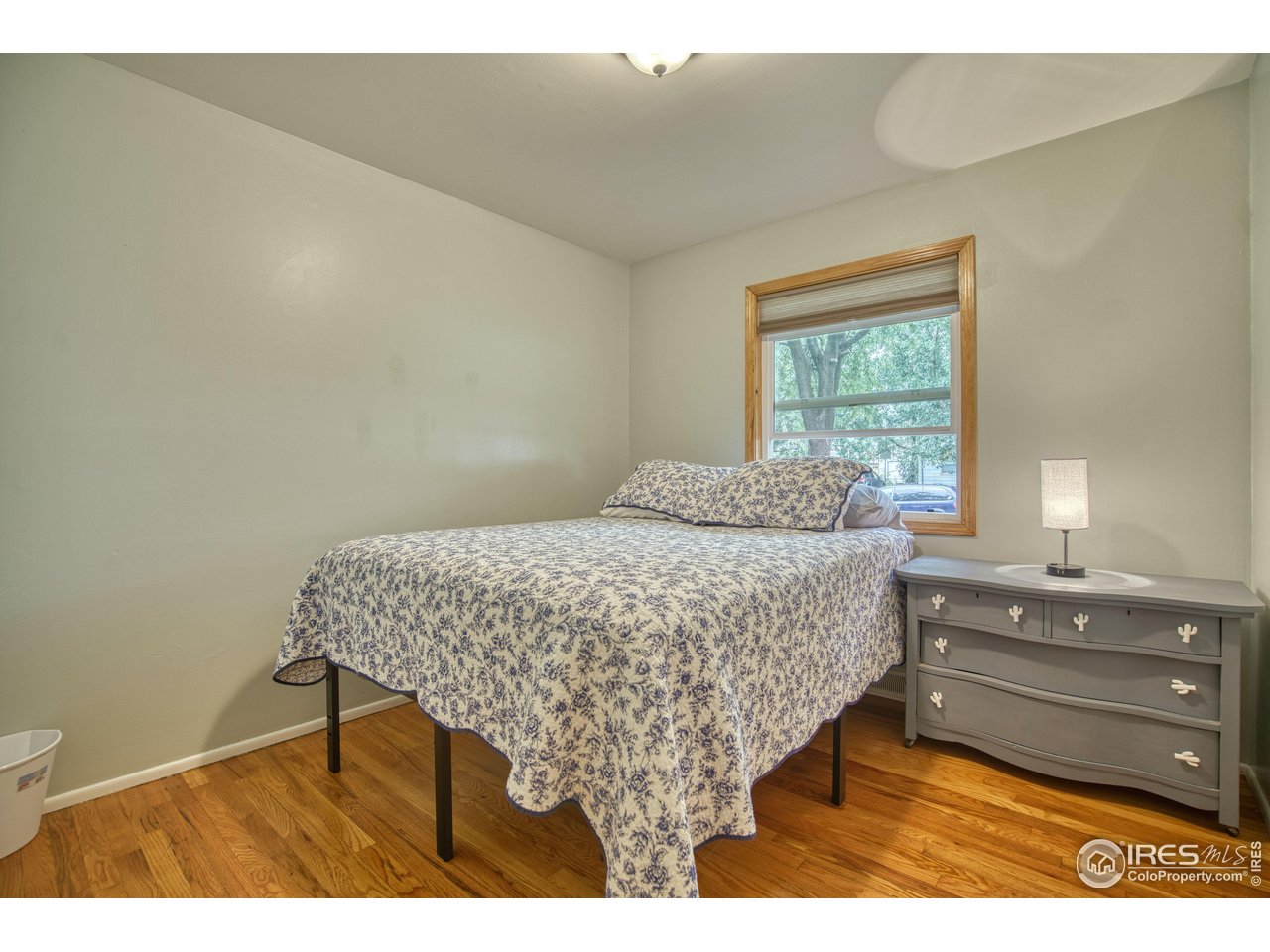 361 Delaware Street Sterling, CO 80751 - Photo 11 of 27 a bedroom with a bed and a dresser