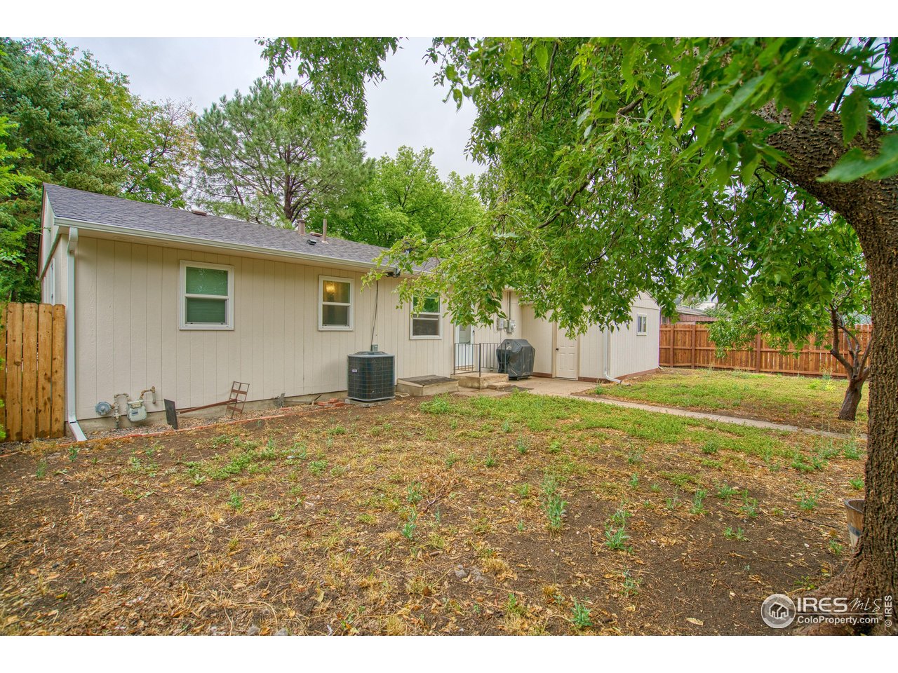361 Delaware Street Sterling, CO 80751 - Photo 18 of 27 a view of a house with a backyard