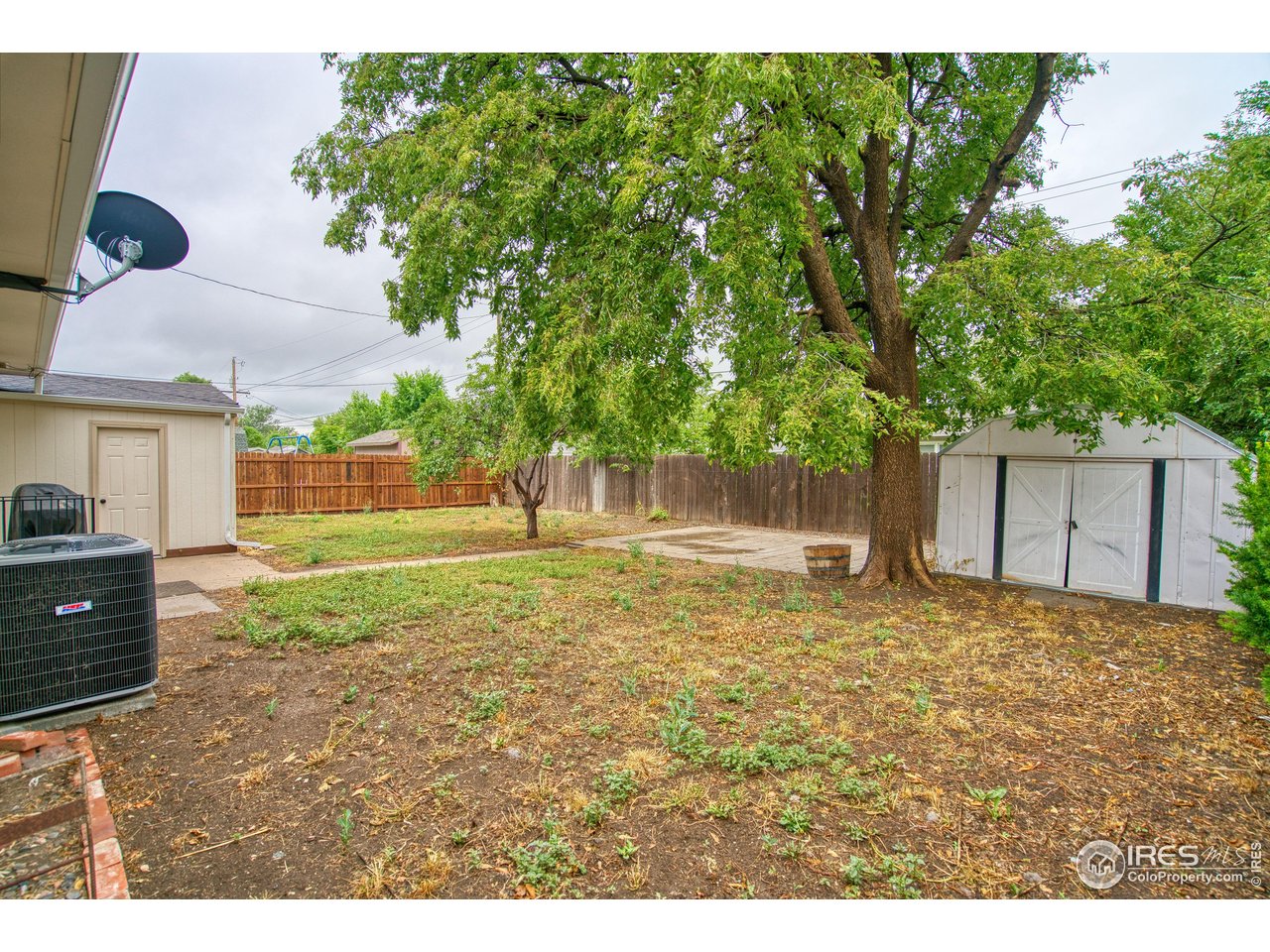 361 Delaware Street Sterling, CO 80751 - Photo 20 of 27 a backyard of a house with lots of green space