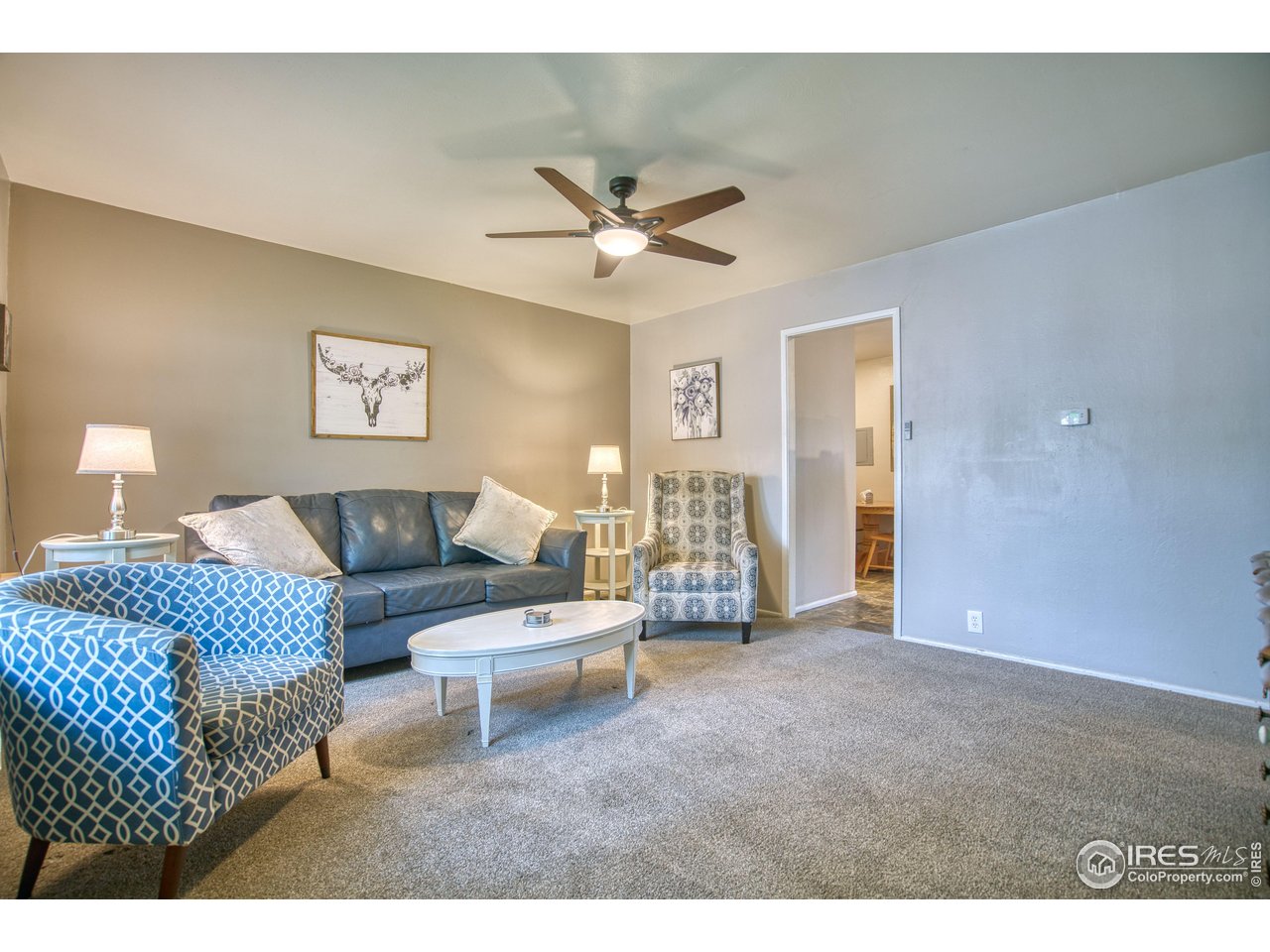 361 Delaware Street Sterling, CO 80751 - Photo 2 of 27 a living room with furniture and a rug