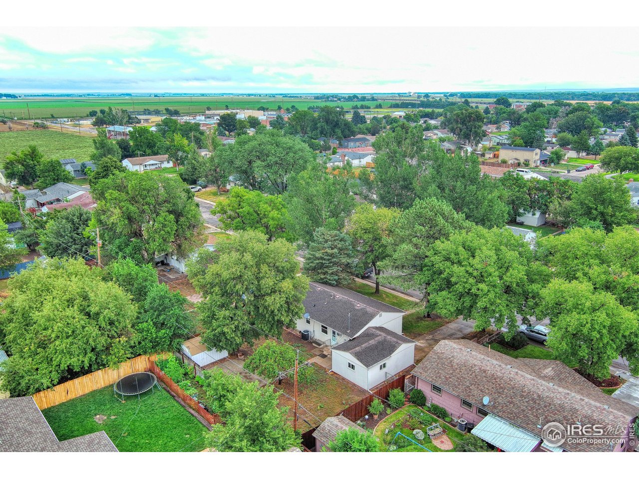 361 Delaware Street Sterling, CO 80751 - Photo 27 of 27 an aerial view of residential houses with outdoor space and trees