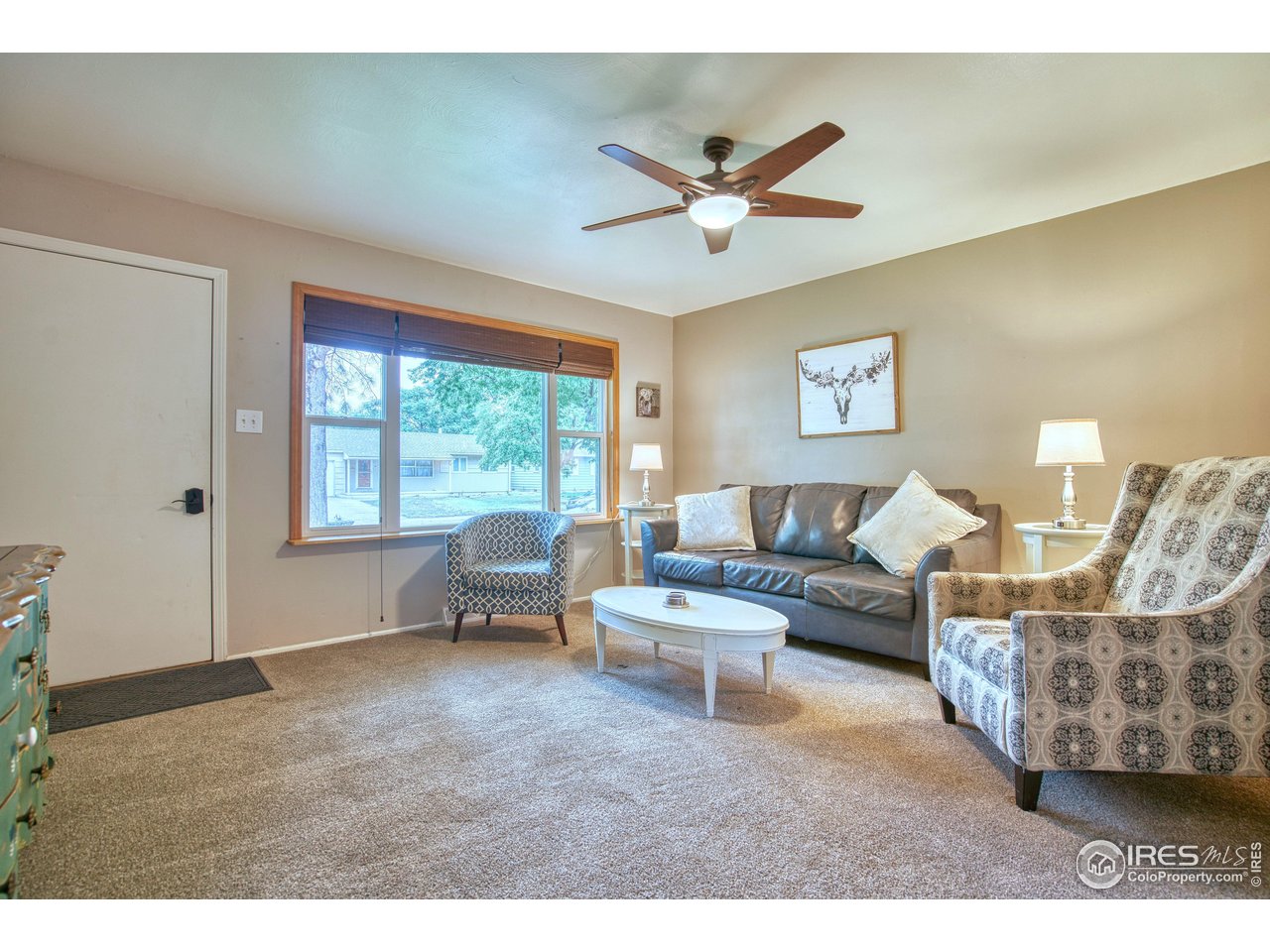 361 Delaware Street Sterling, CO 80751 - Photo 3 of 27 a living room with furniture and a window