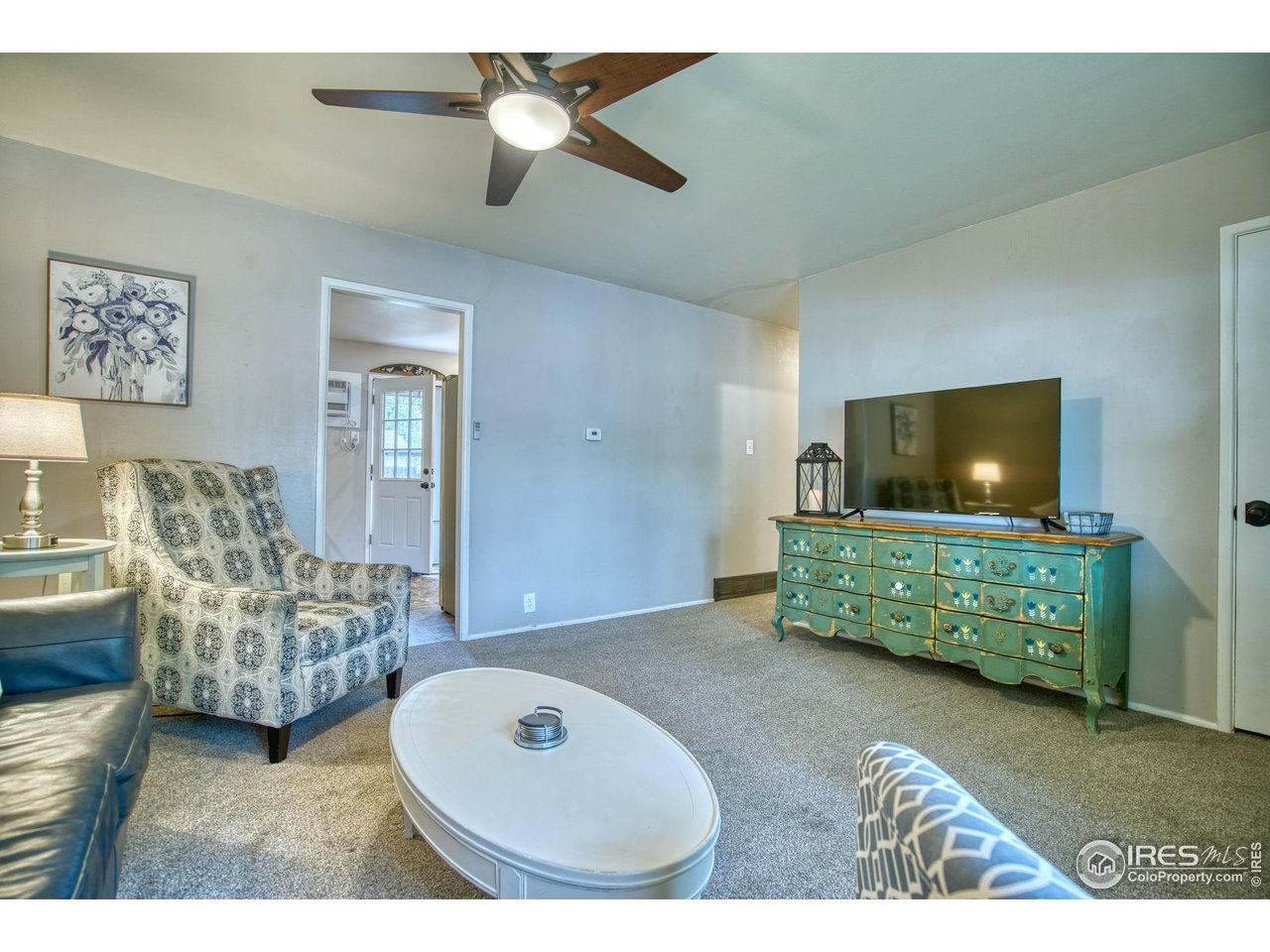 361 Delaware Street Sterling, CO 80751 - Photo 5 of 27 a living room with furniture and a flat screen tv