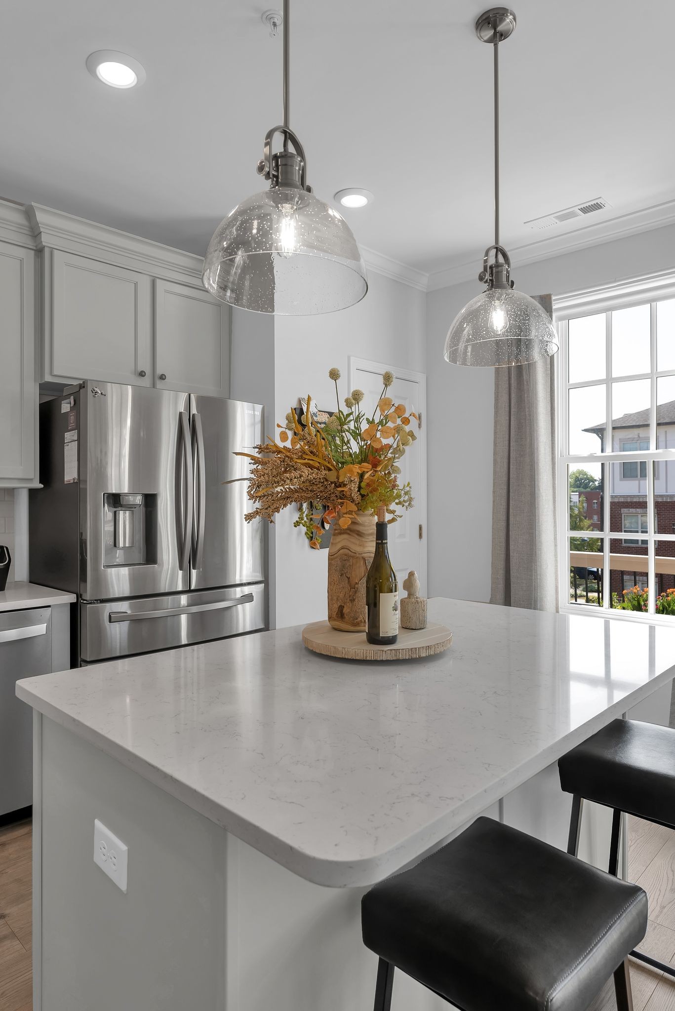 2083 Tollgate Boulevard Thompson's Station, TN 37179 - Photo 16 of 40 a kitchen with stainless steel appliances a table and chairs