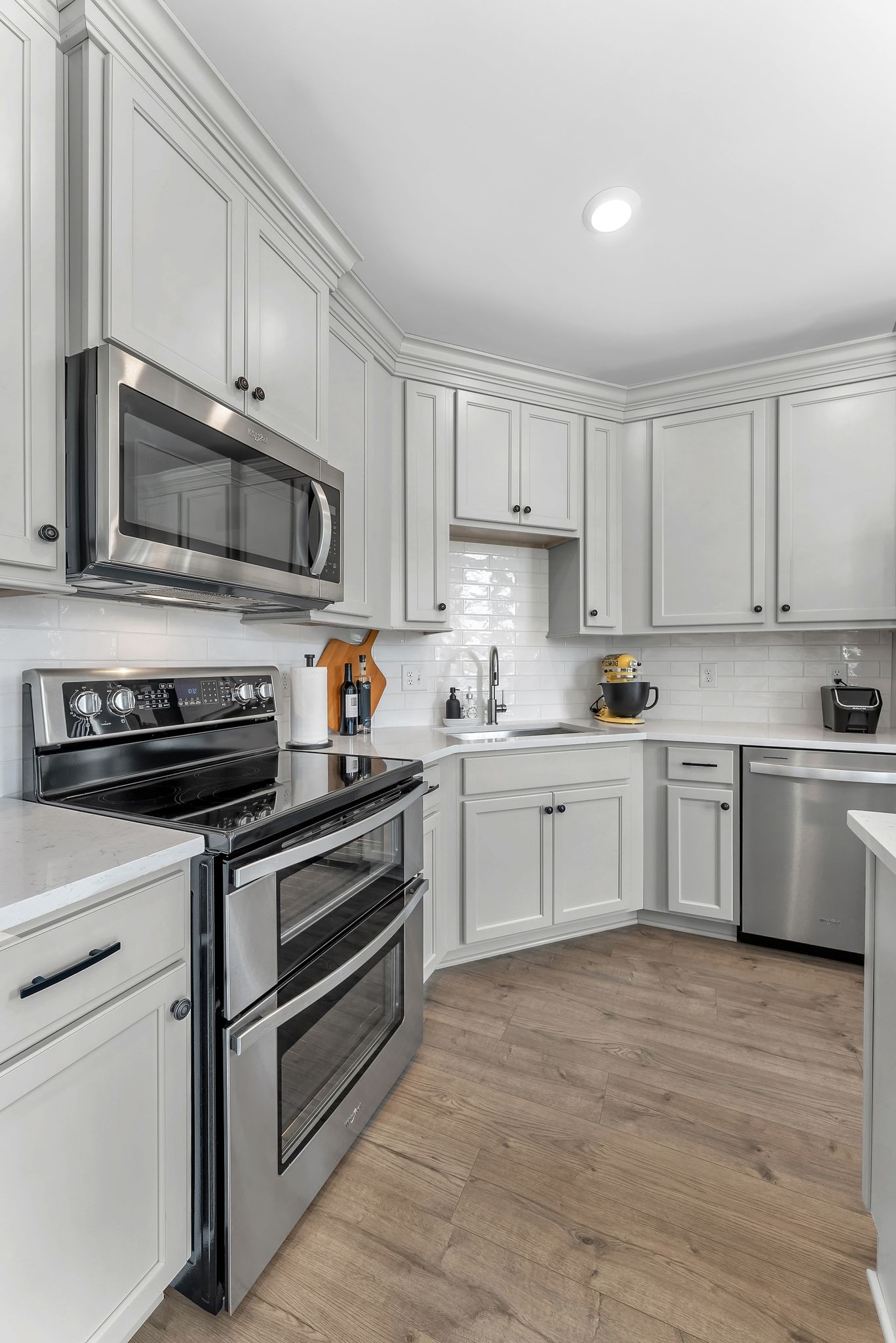 2083 Tollgate Boulevard Thompson's Station, TN 37179 - Photo 17 of 40 a kitchen with granite countertop white cabinets and stainless steel appliances