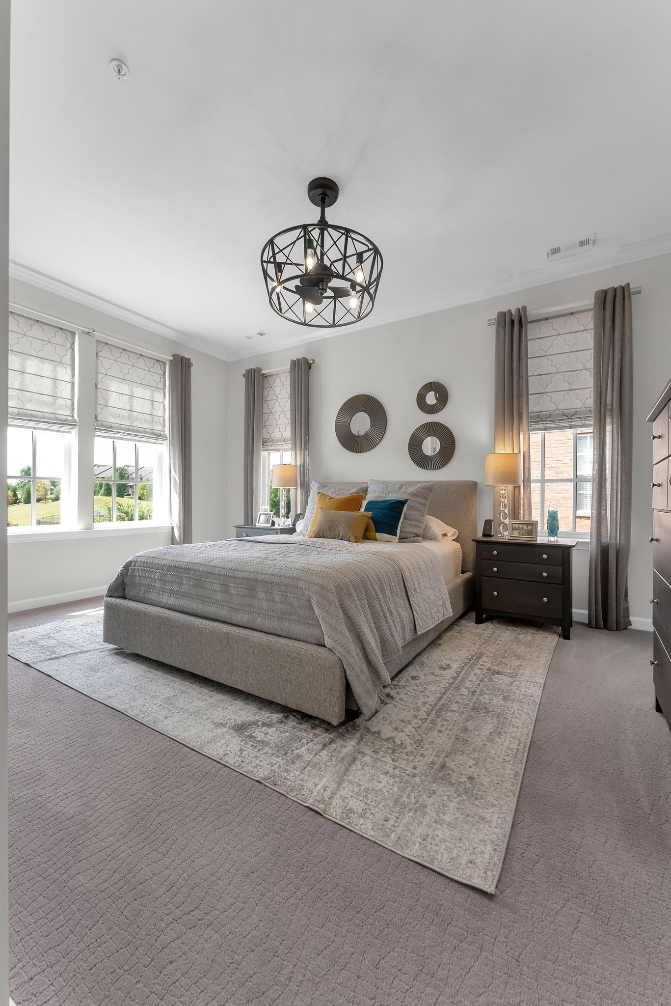 2083 Tollgate Boulevard Thompson's Station, TN 37179 - Photo 25 of 40 a bedroom with a large bed and a chandelier