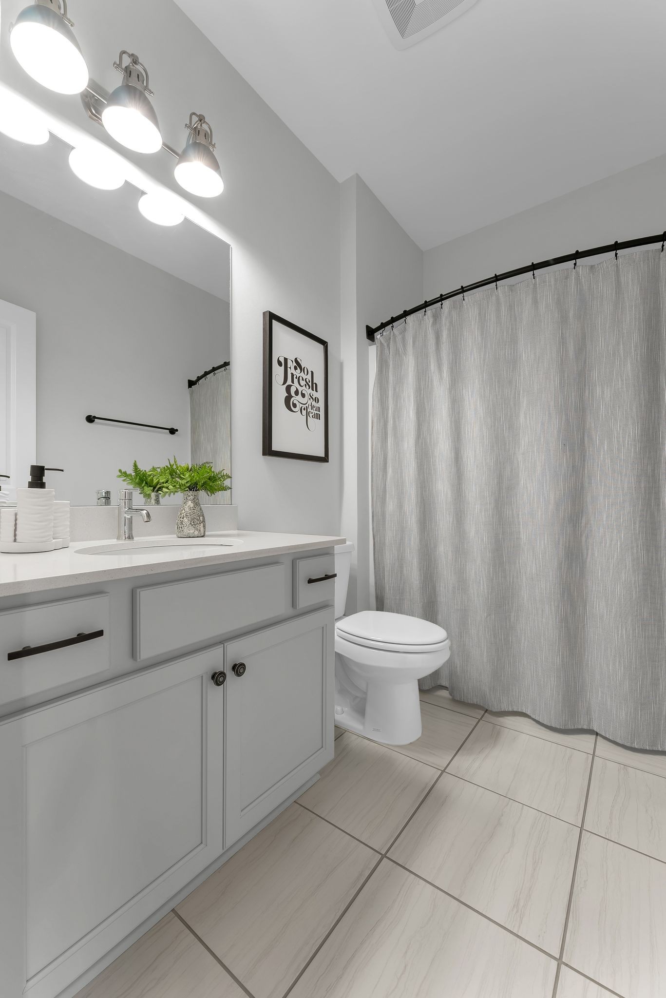 2083 Tollgate Boulevard Thompson's Station, TN 37179 - Photo 26 of 40 a bathroom with a sink a toilet and mirror