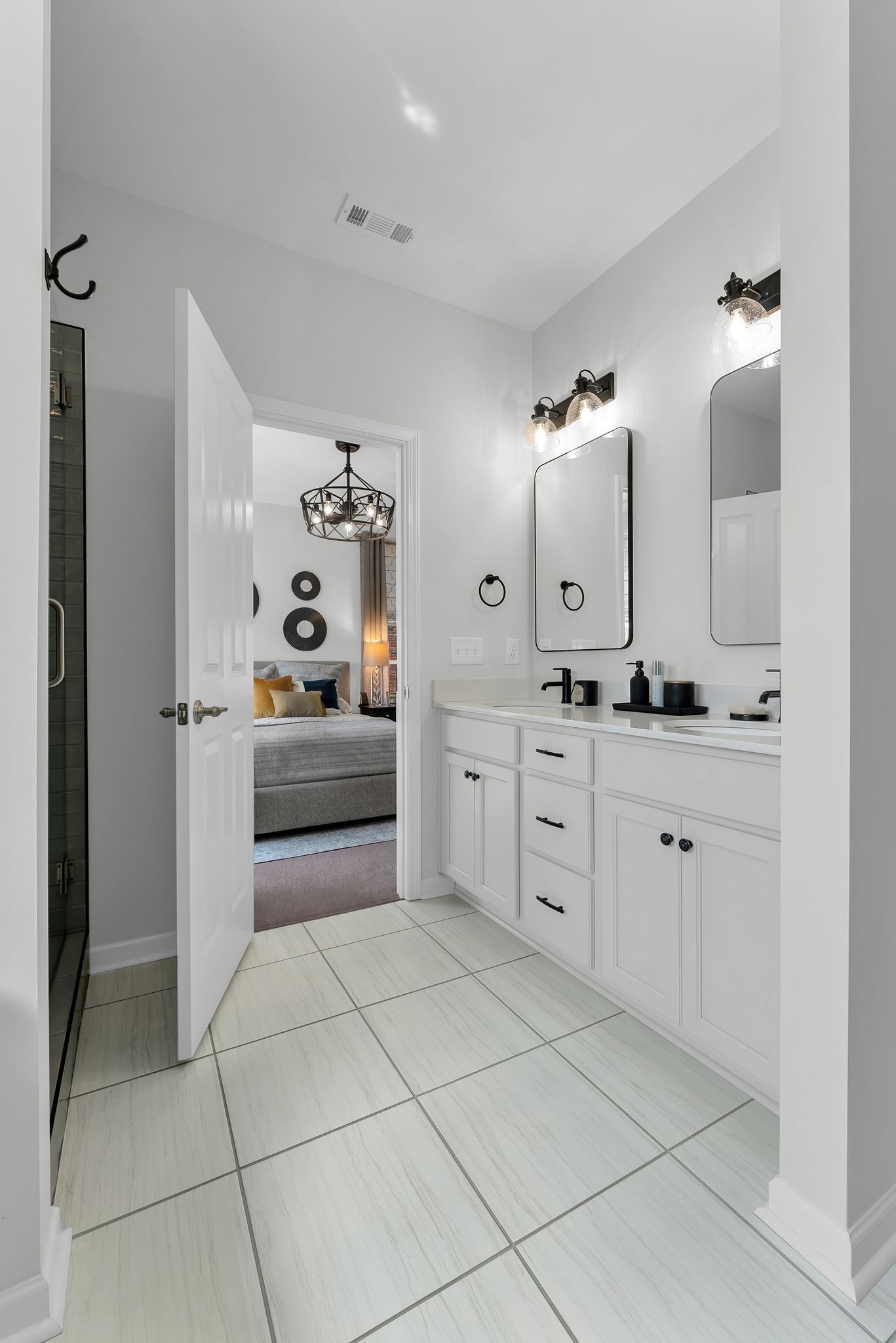 2083 Tollgate Boulevard Thompson's Station, TN 37179 - Photo 31 of 40 a spacious bathroom with a double vanity sink and mirror
