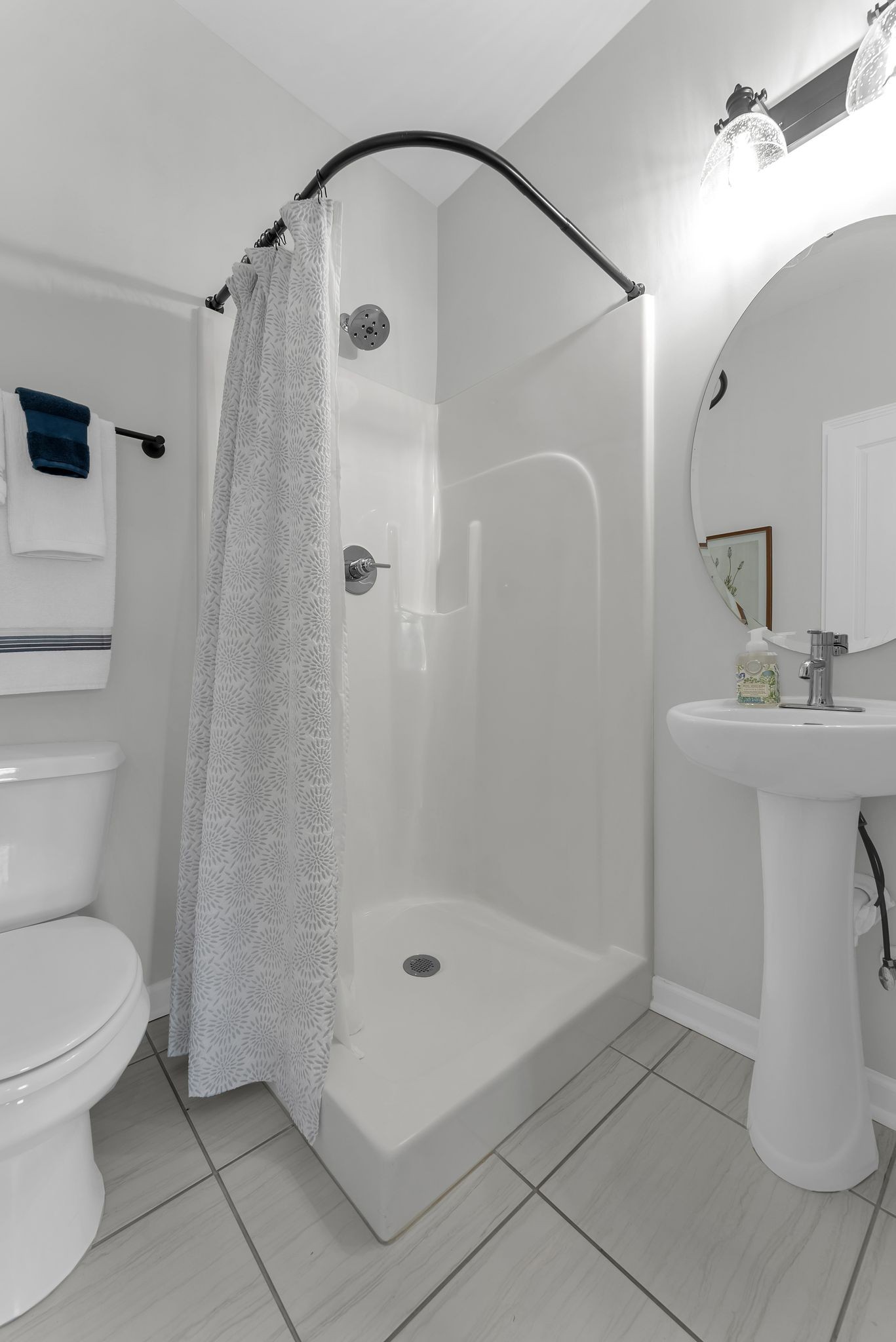 2083 Tollgate Boulevard Thompson's Station, TN 37179 - Photo 8 of 40 a bathroom with a sink a toilet and shower