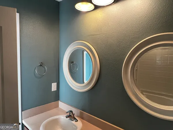 a bathroom with a toilet and a sink