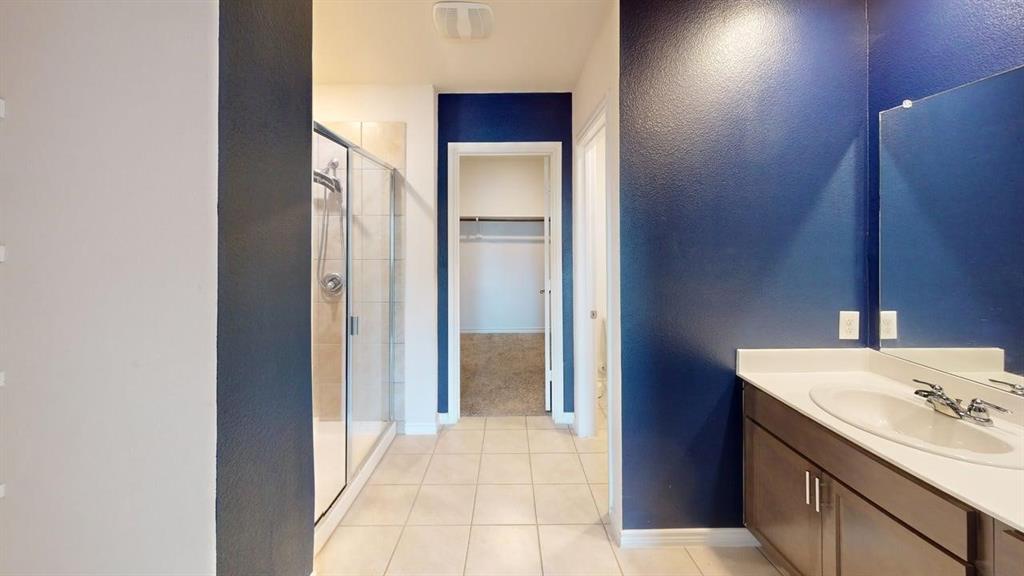 405 Rawhide Way Princeton, TX 75407 - Photo 16 of 22 a bathroom with a sink and a mirror