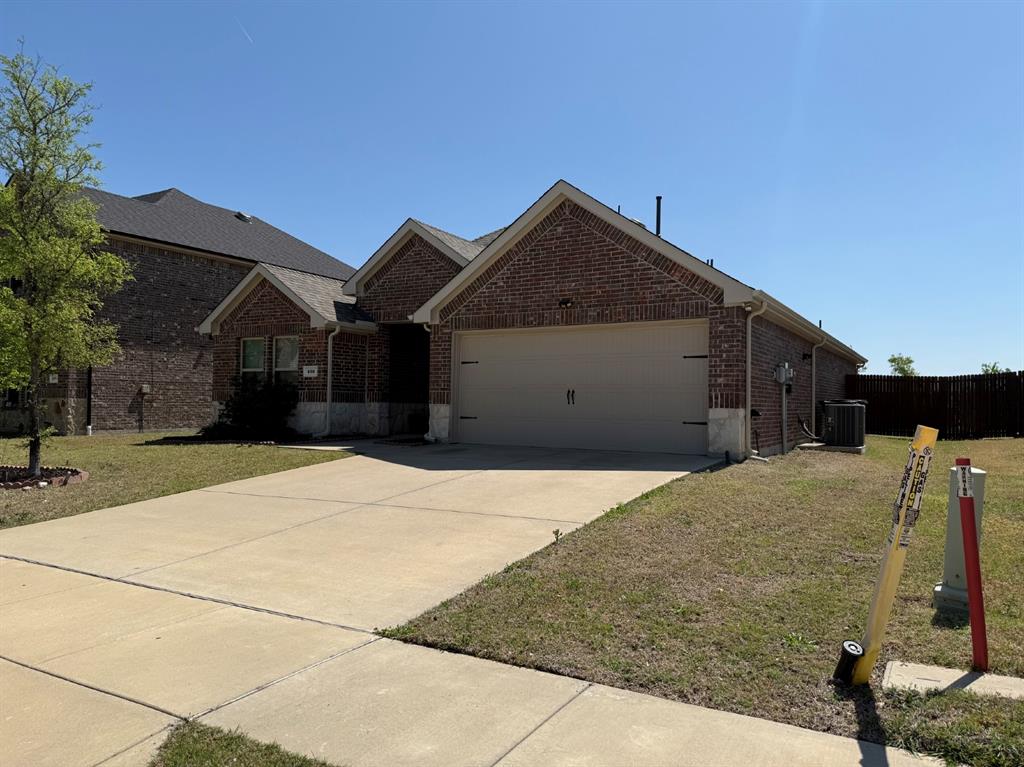 405 Rawhide Way Princeton, TX 75407 - Photo 2 of 22 a front view of house with a yard