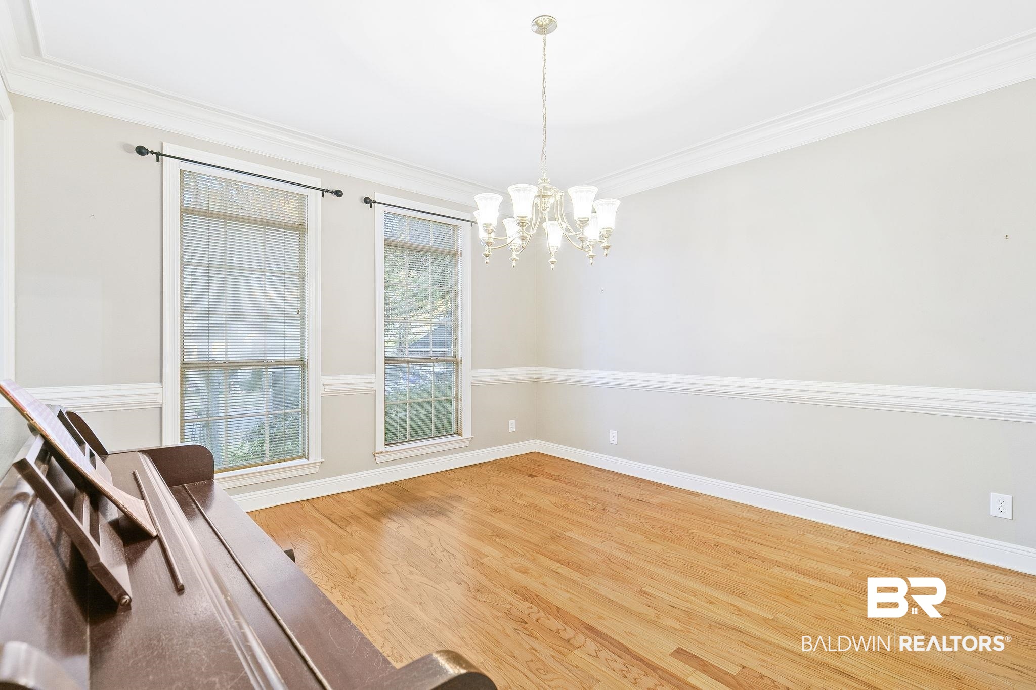 2100 Stonebrook Drive West Mobile, AL 36695 - Photo 15 of 60 Formal Diningroom with crown molding, hardwood / wood-style floors, and a notable chandelier