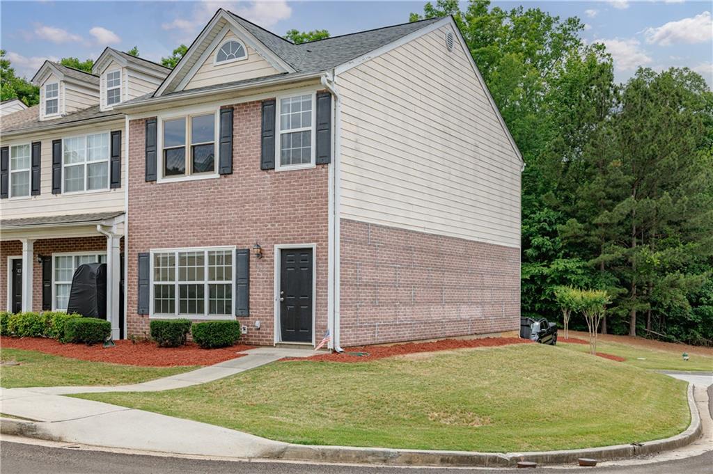 4203 Legacy Square Atlanta, GA 30349 - Photo 6 of 35 a view of a white house with a swimming pool and brick walls