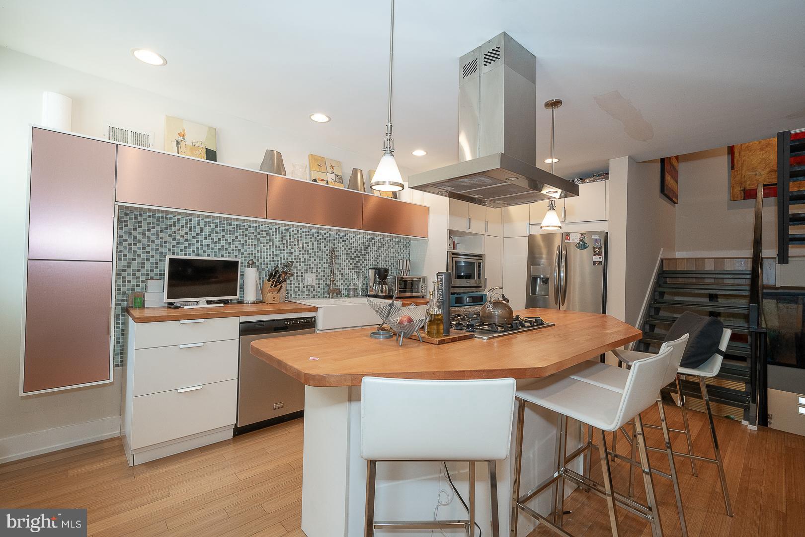 715 Shirley Street, Unit A Philadelphia, PA 19130 - Photo 3 of 24 a kitchen with a table and chairs in it