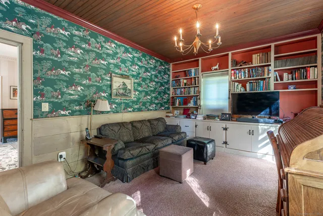 a outdoor living space with furniture and a flat screen tv