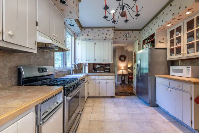a kitchen with a stove and a refrigerator