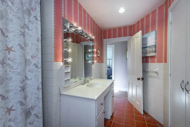 a bathroom with a sink and a mirror