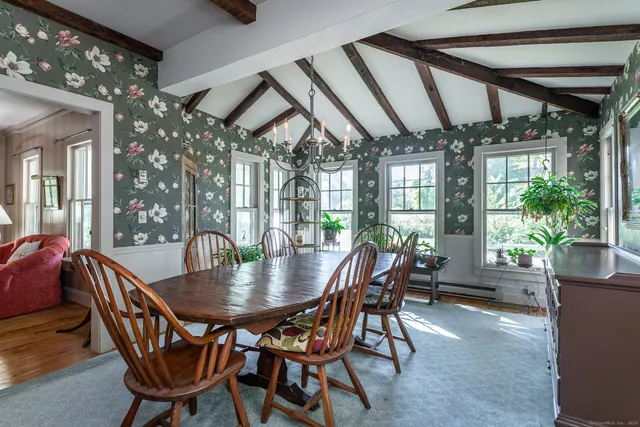 a view of a dining room with furniture window and outside view