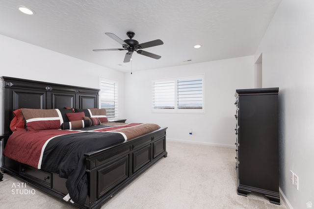 540 Lefty Lane Tooele, UT 84074 - Photo 21 of 48 Bedroom featuring light carpet, ceiling fan, and recessed lighting