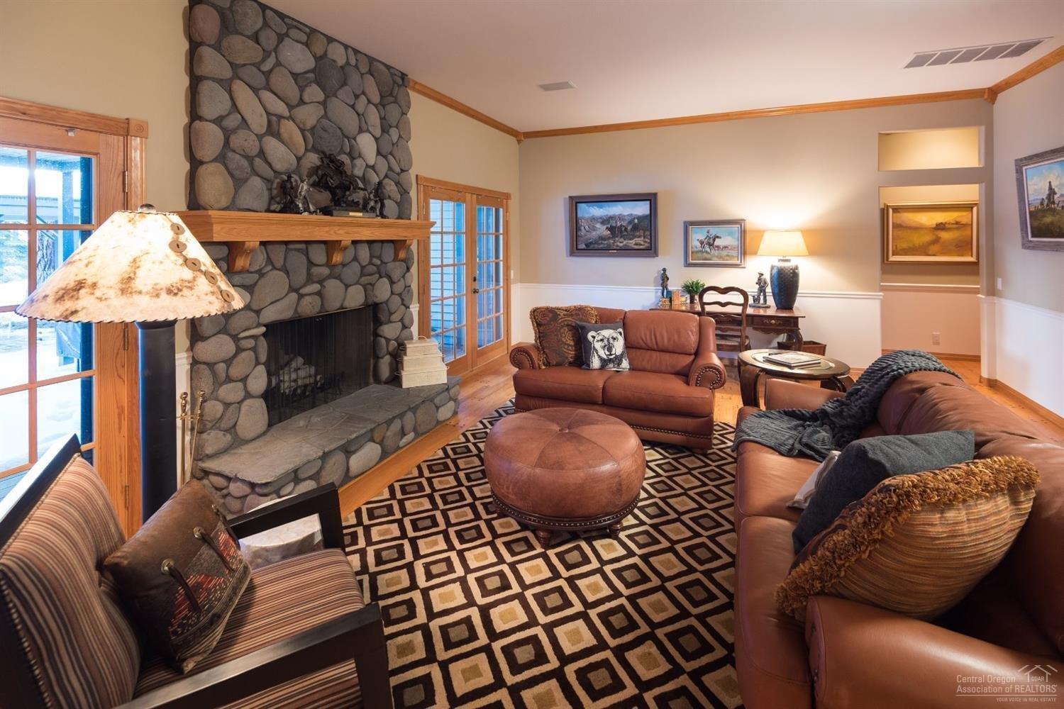 16190 Foothill Loop Sisters, OR 97759 - Photo 6 of 25 Living Room with River Rock Wood Firepla