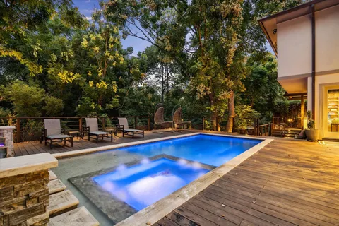 a view of a swimming pool with lounge chair