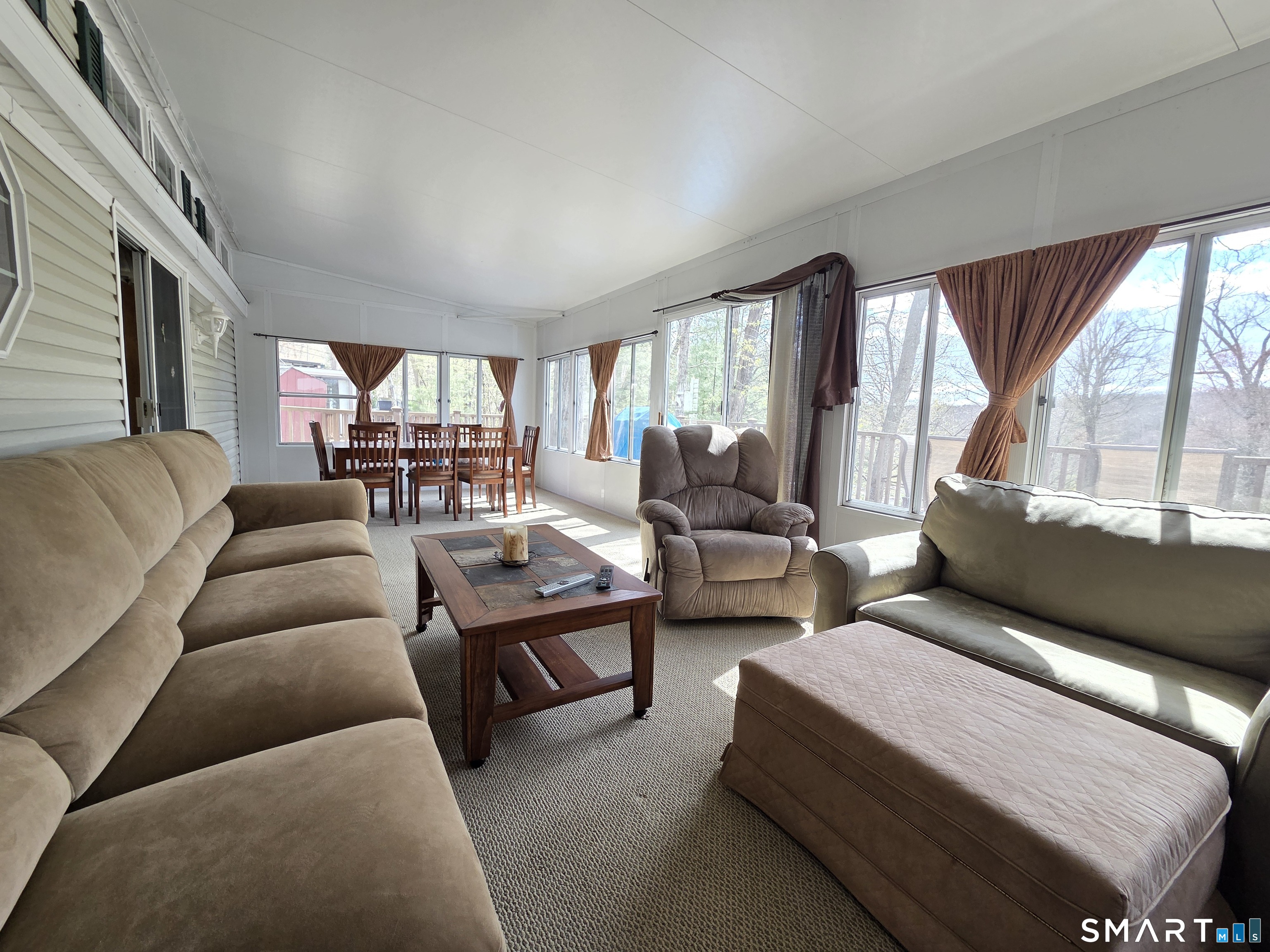 8 S Road, Unit WW108 Stafford, CT 06076 - Photo 14 of 18 a living room with furniture and a large window