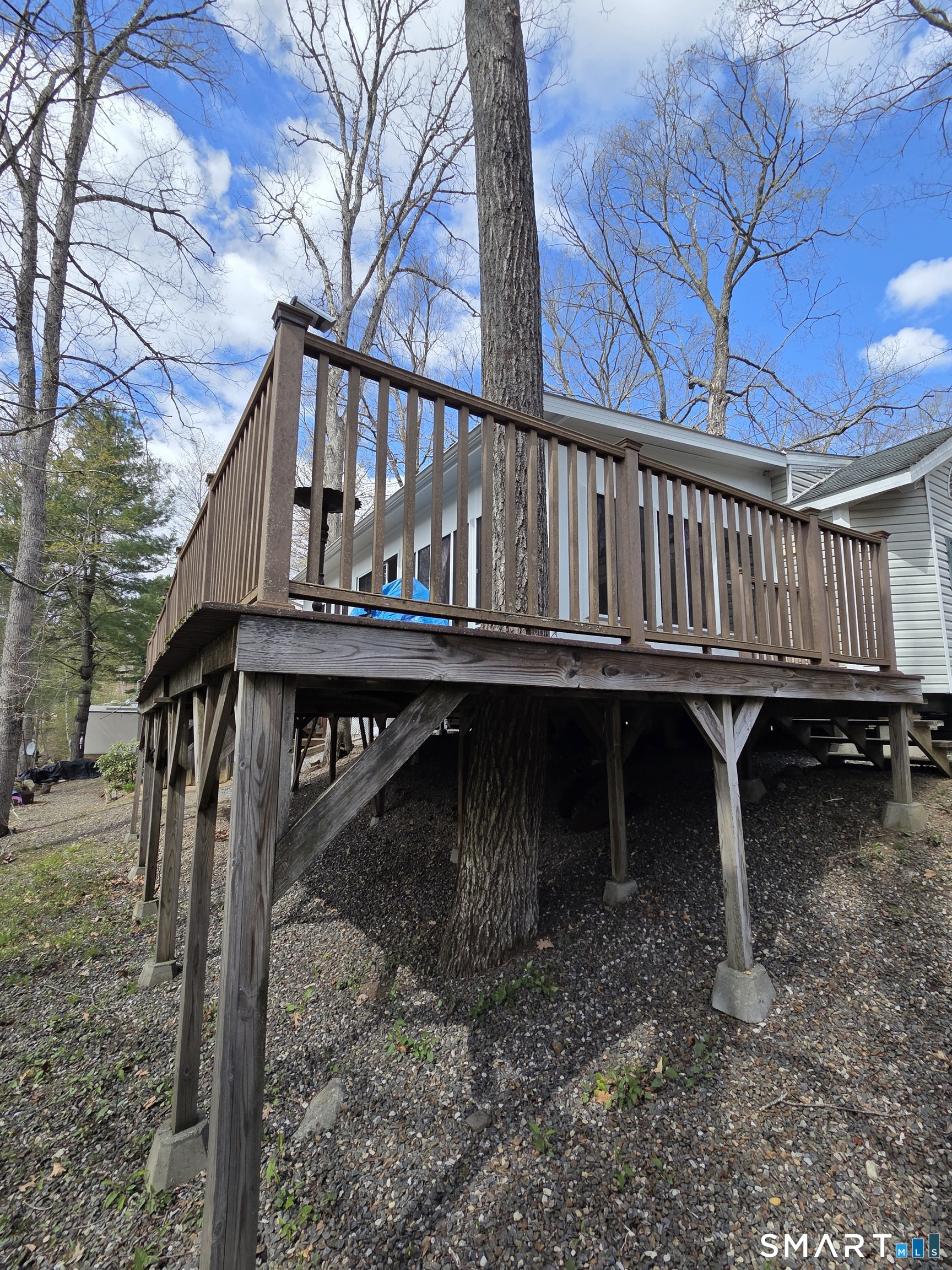 8 S Road, Unit WW108 Stafford, CT 06076 - Photo 17 of 18 a view of wooden house with a roof deck