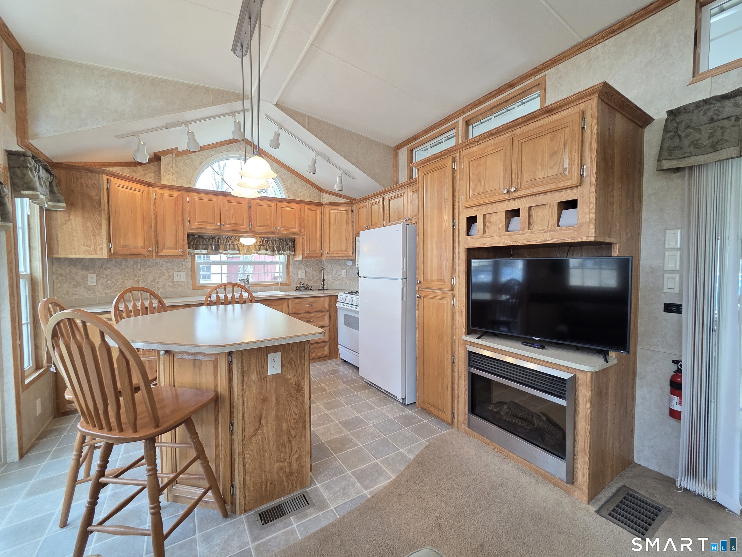 8 S Road, Unit WW108 Stafford, CT 06076 - Photo 3 of 18 a kitchen with stainless steel appliances a stove a sink and a microwave