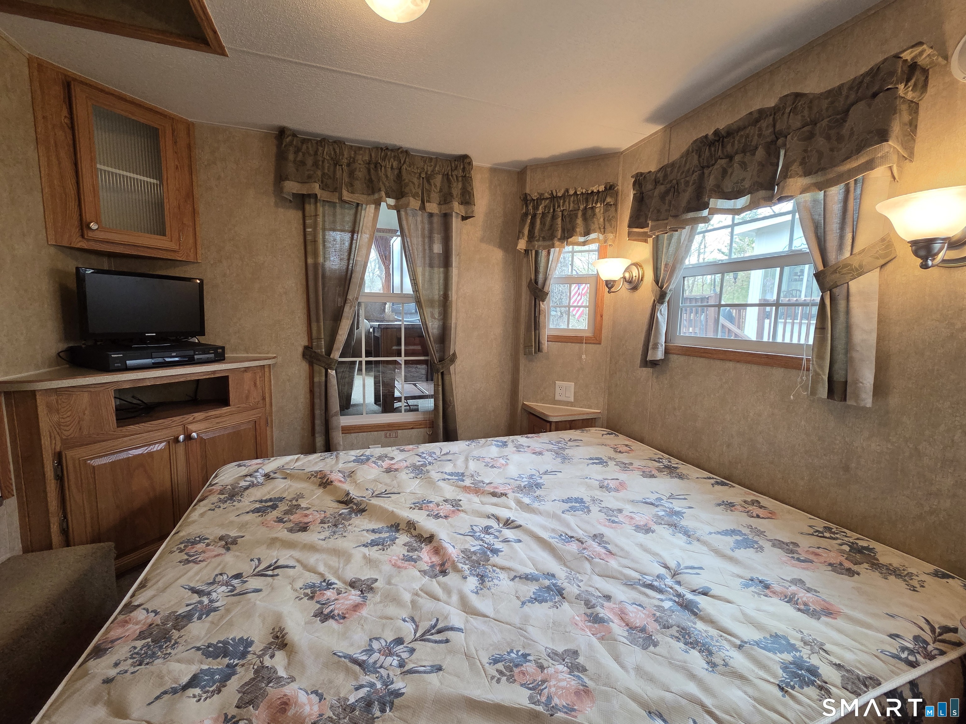 8 S Road, Unit WW108 Stafford, CT 06076 - Photo 8 of 18 a bedroom with a bed and wooden floor