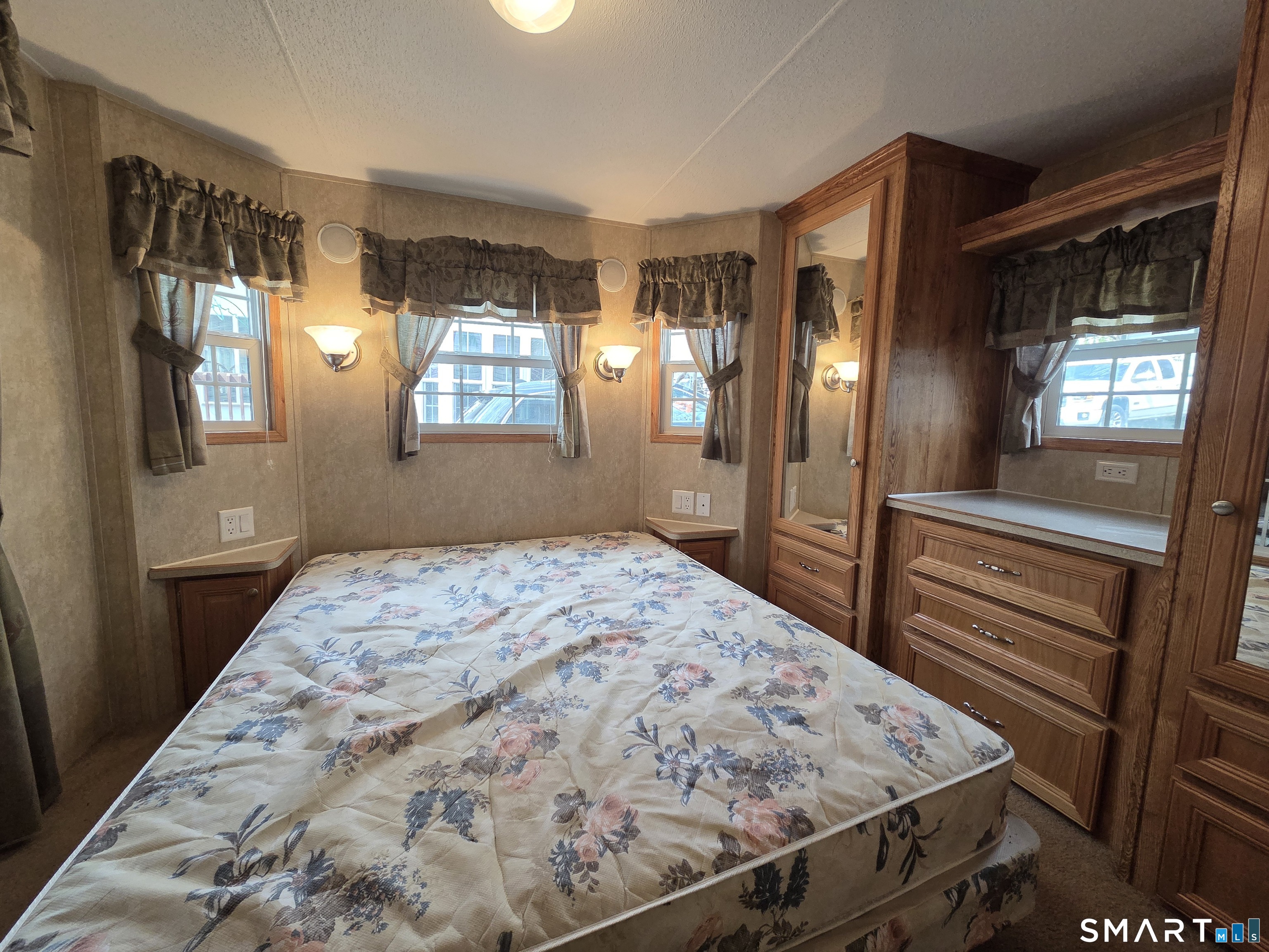 8 S Road, Unit WW108 Stafford, CT 06076 - Photo 9 of 18 a bedroom with a bed and window