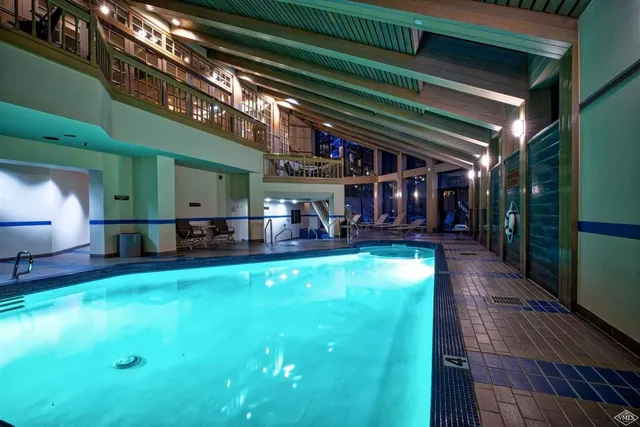 a view of a chairs and a table in the patio