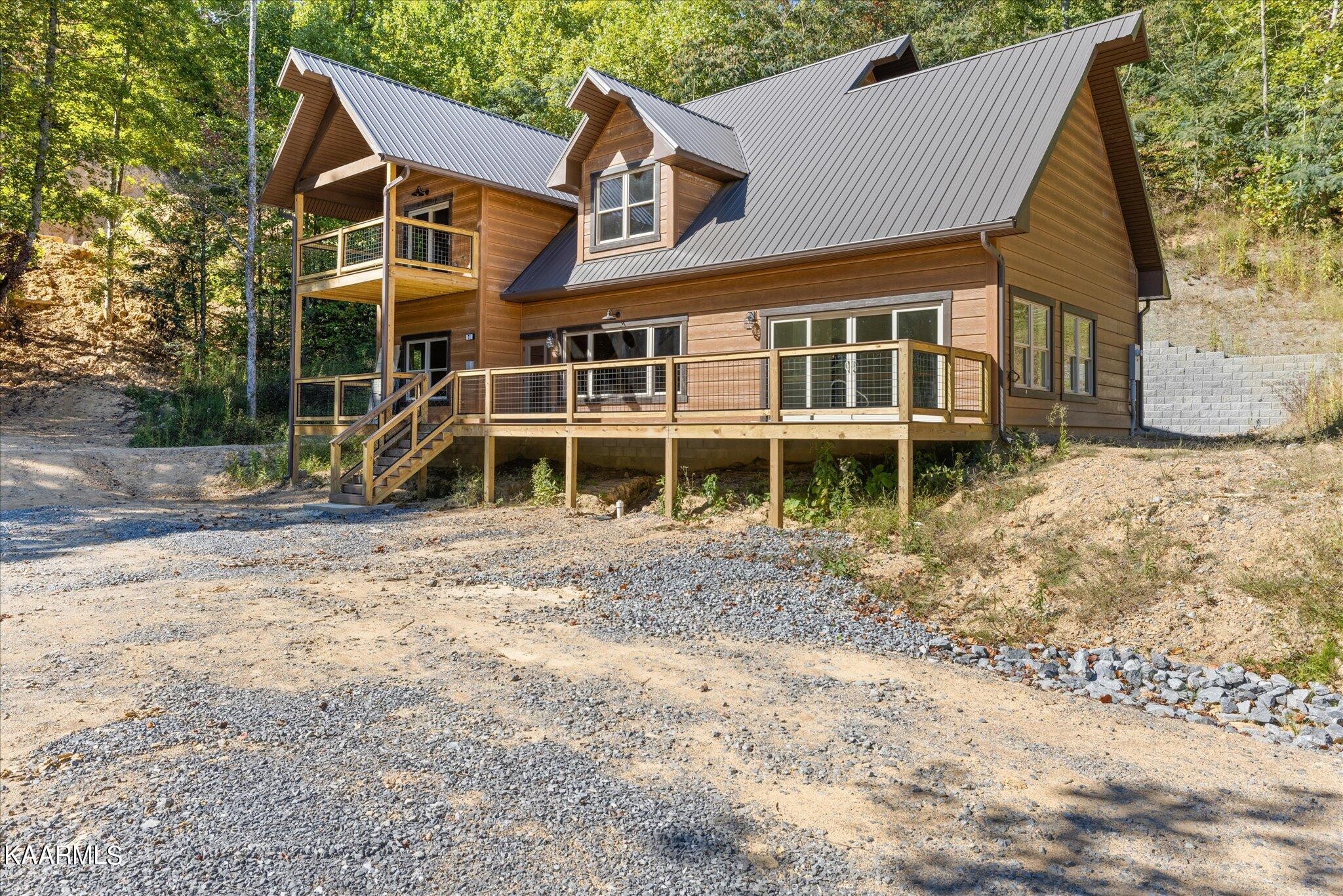 4228 Wears Valley Road, Unit 71 Sevierville, TN 37862 - Photo 1 of 28 a front view of a house with a yard