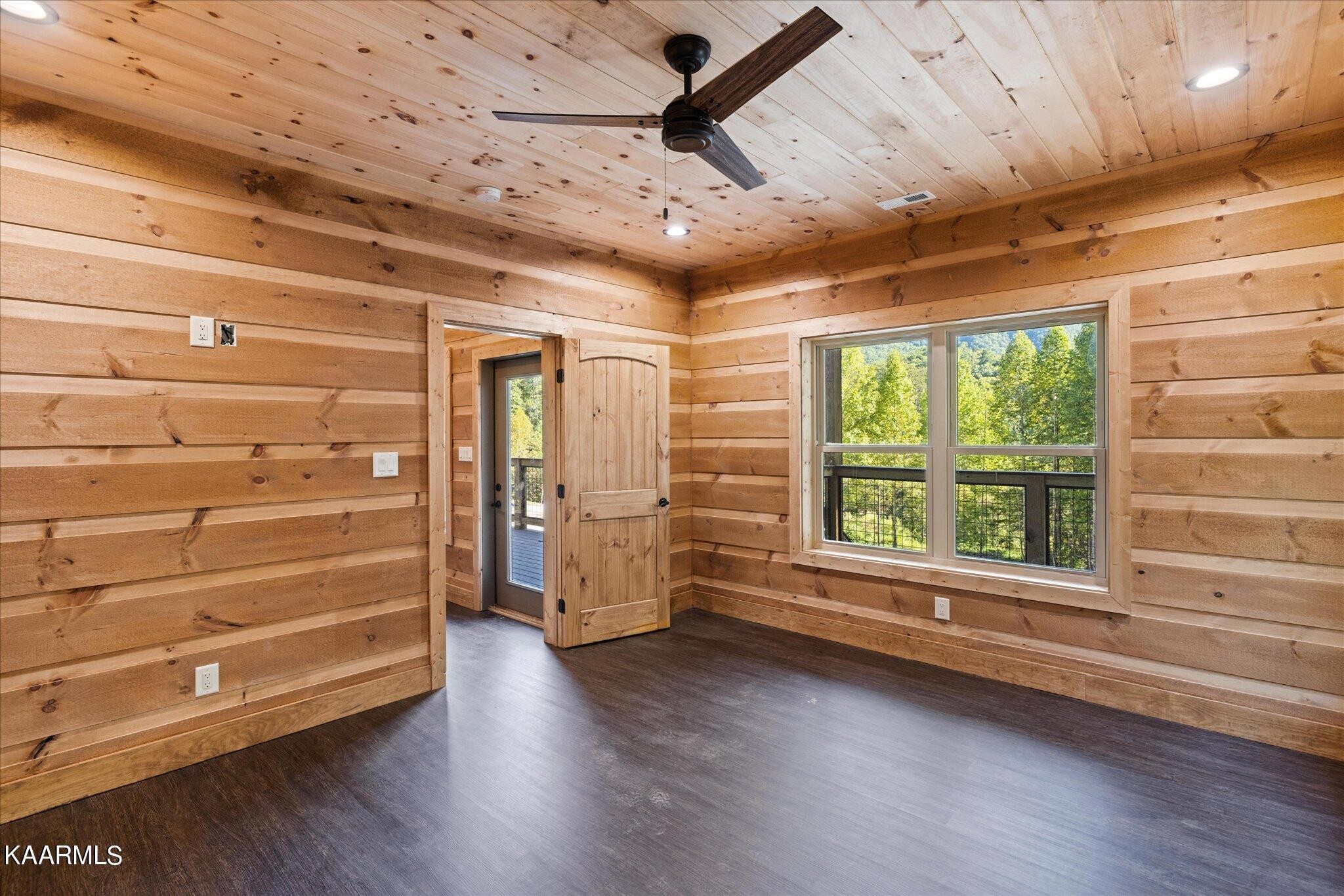 4228 Wears Valley Road, Unit 71 Sevierville, TN 37862 - Photo 17 of 28 a view of room with window and wooden floor