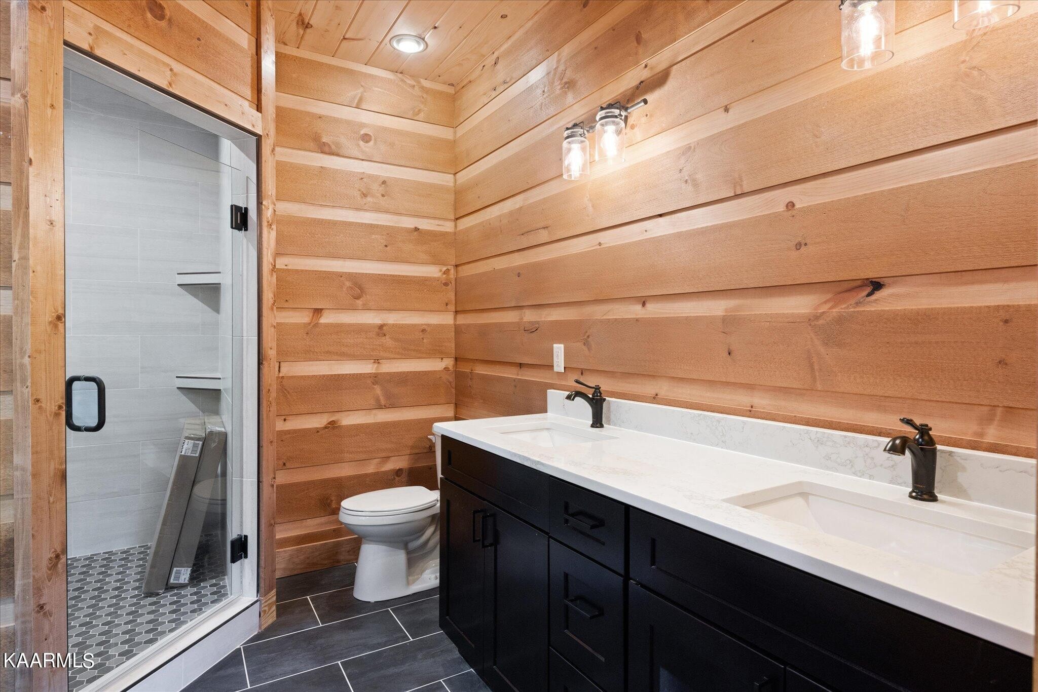 4228 Wears Valley Road, Unit 71 Sevierville, TN 37862 - Photo 18 of 28 a bathroom with a sink a toilet and shower