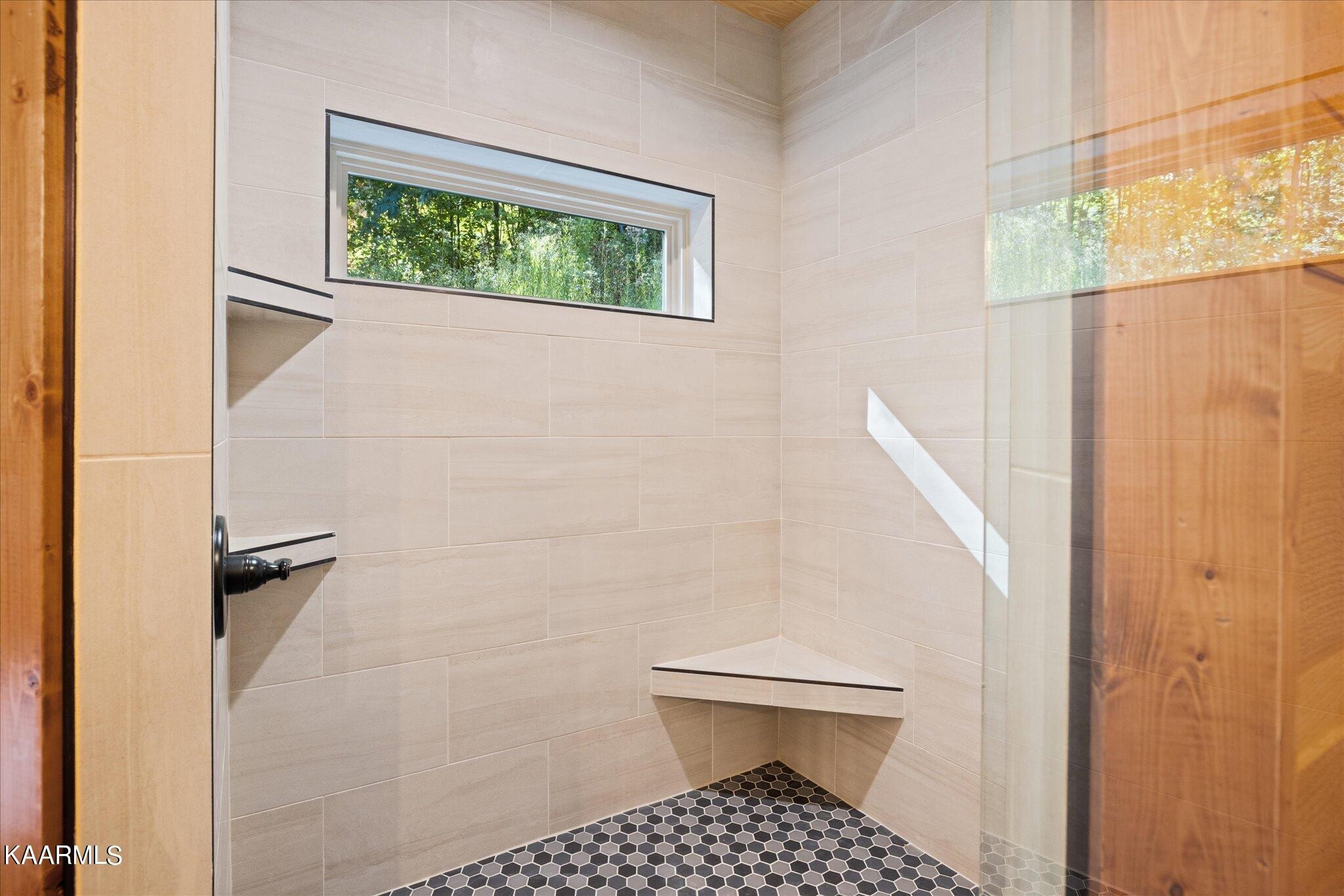 4228 Wears Valley Road, Unit 71 Sevierville, TN 37862 - Photo 20 of 28 a bathroom with a toilet and a shower