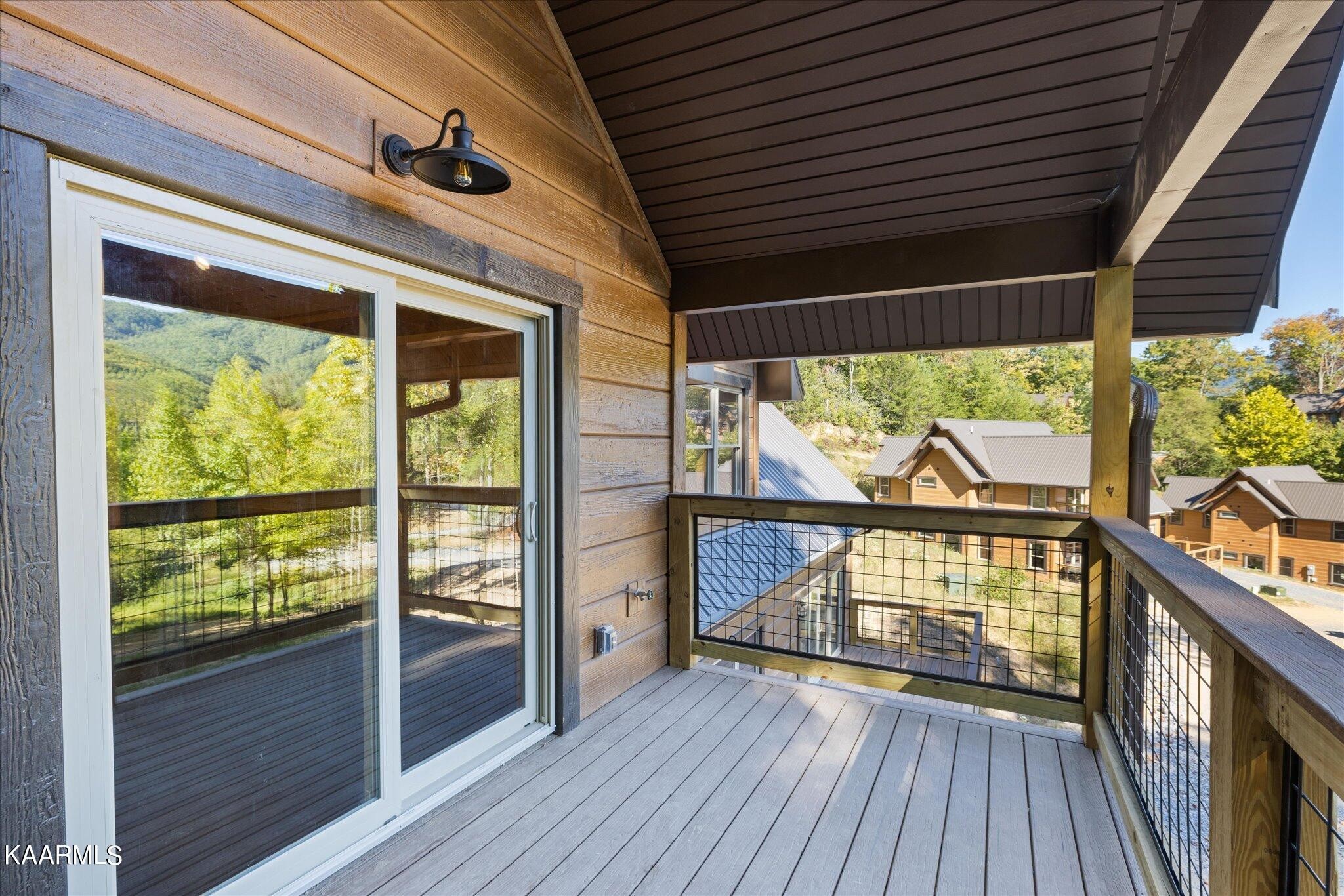 4228 Wears Valley Road, Unit 71 Sevierville, TN 37862 - Photo 2 of 28 a view of a porch with wooden floor and outdoor space