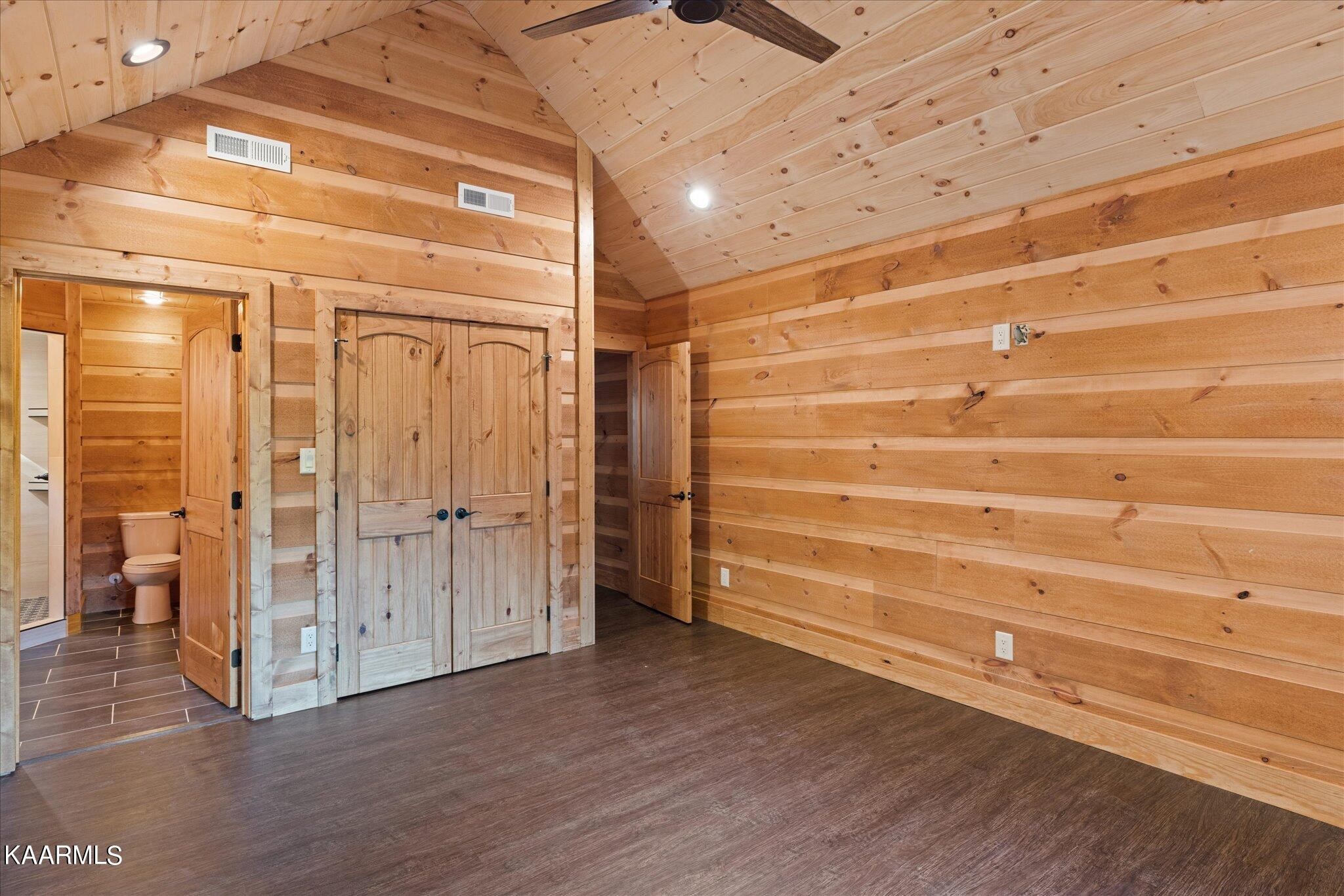 4228 Wears Valley Road, Unit 71 Sevierville, TN 37862 - Photo 27 of 28 a view of an empty room with wooden floor and a window