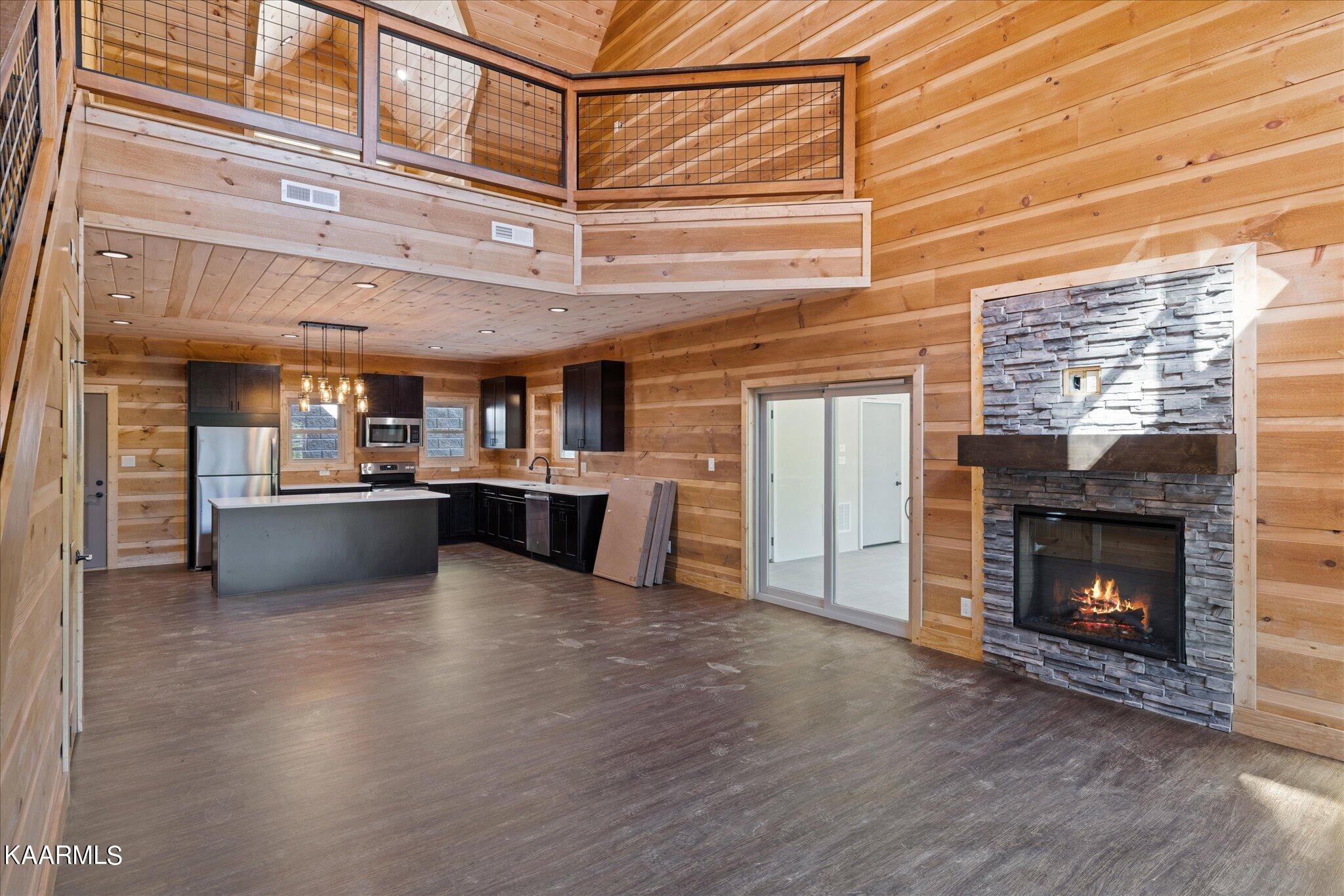 4228 Wears Valley Road, Unit 71 Sevierville, TN 37862 - Photo 3 of 28 a view of an empty room with a fireplace and a window